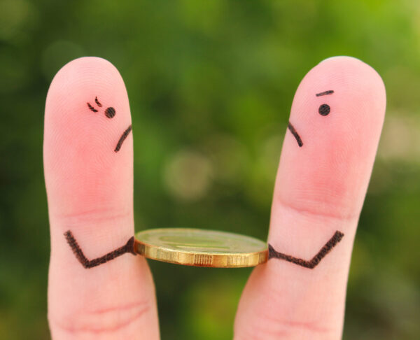 Fingers art of family during quarrel. Concept of man and woman cannot divide money after divorce.